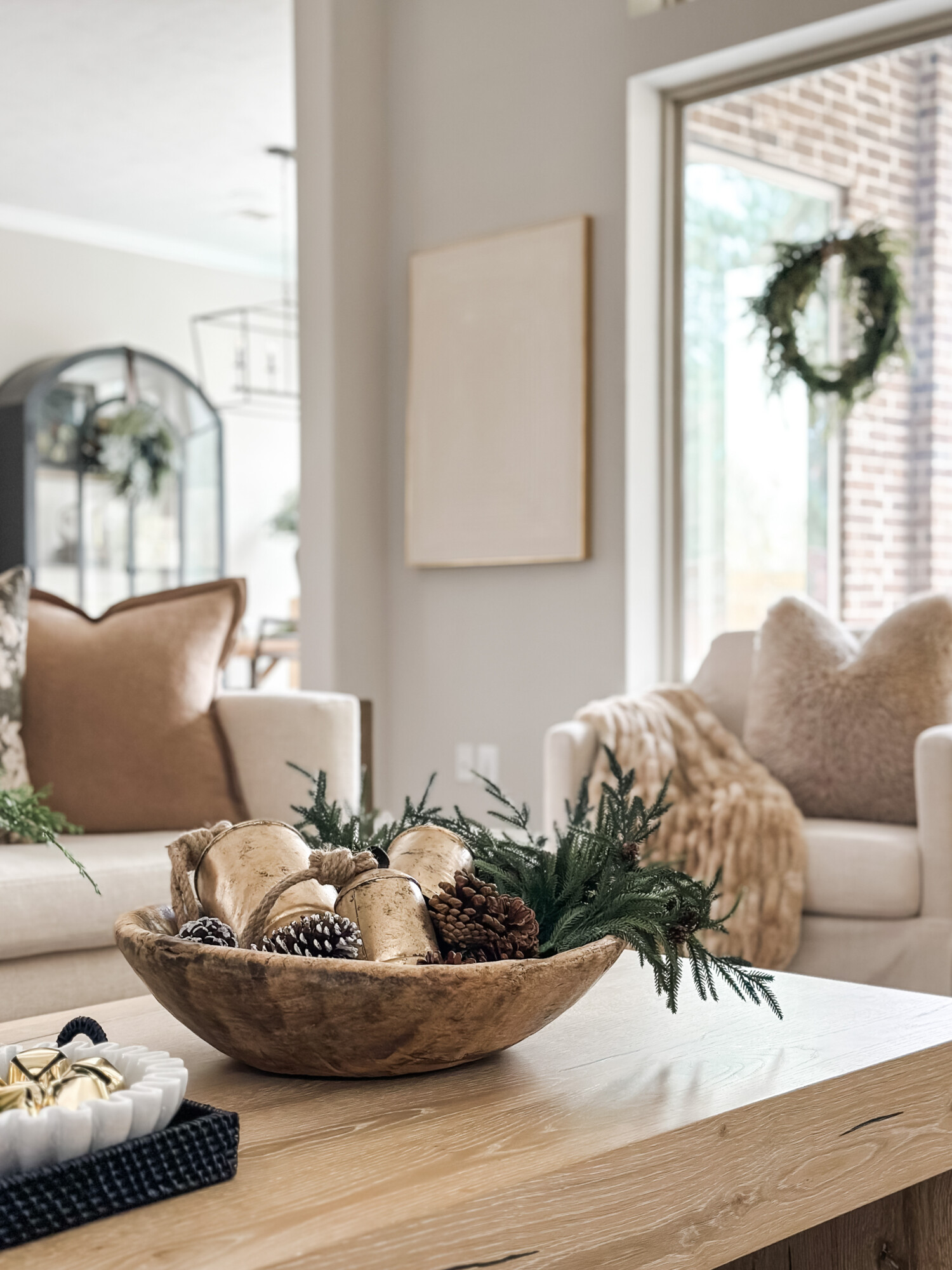 home for the holidays decor round up | holiday, holiday home, holiday home tour, holiday table, holiday coffee table, pinecones, faux greenery, bells, jingle bells, Christmas, Christmas decor
