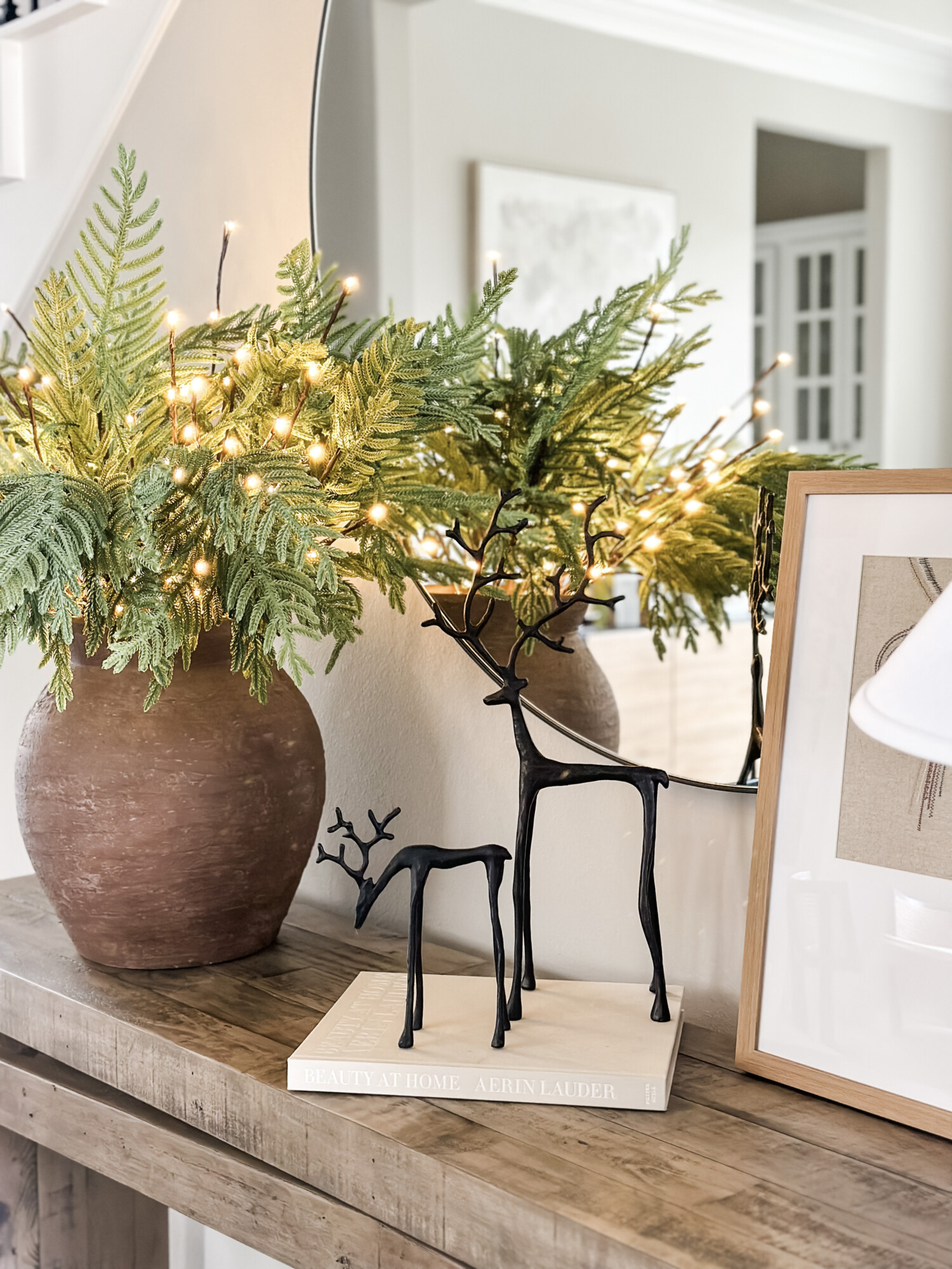 home for the holidays decor round up | holiday, holiday home, holiday home tour, holiday table, table decor, twig lights, faux greenery, reindeer decor, console table styling