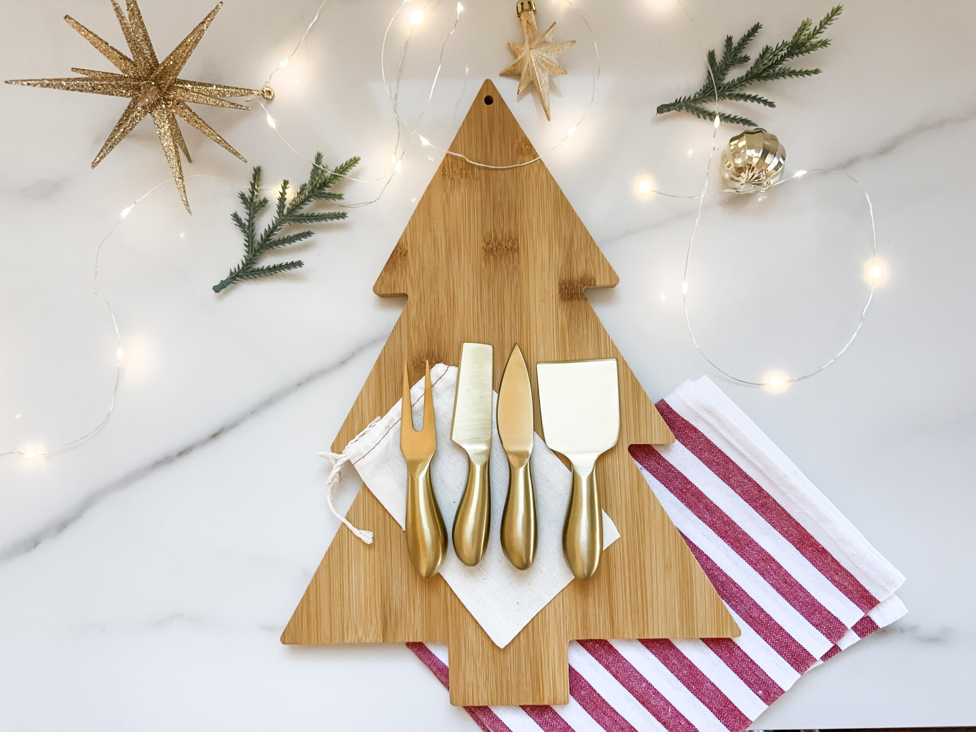 thoughtful and affordable diy host gifts under $35 | host gifts, diy gifts, gift ideas, handmade gift, gift ideas, gold silverware, board utensils, aesthetic kitchen, hosting essentials, gift accessories, tiny knives, christmas gift, holiday gift