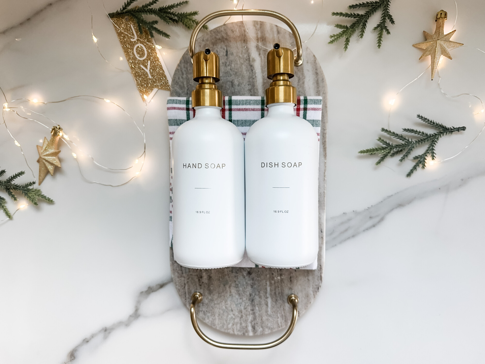 thoughtful and affordable diy host gifts under $35 | host gifts, diy gifts, gift ideas, handmade gift, gift ideas, white soap bottles, dish holiday towel, holiday gift tag, christmas kitchen, kitchen christmas gift