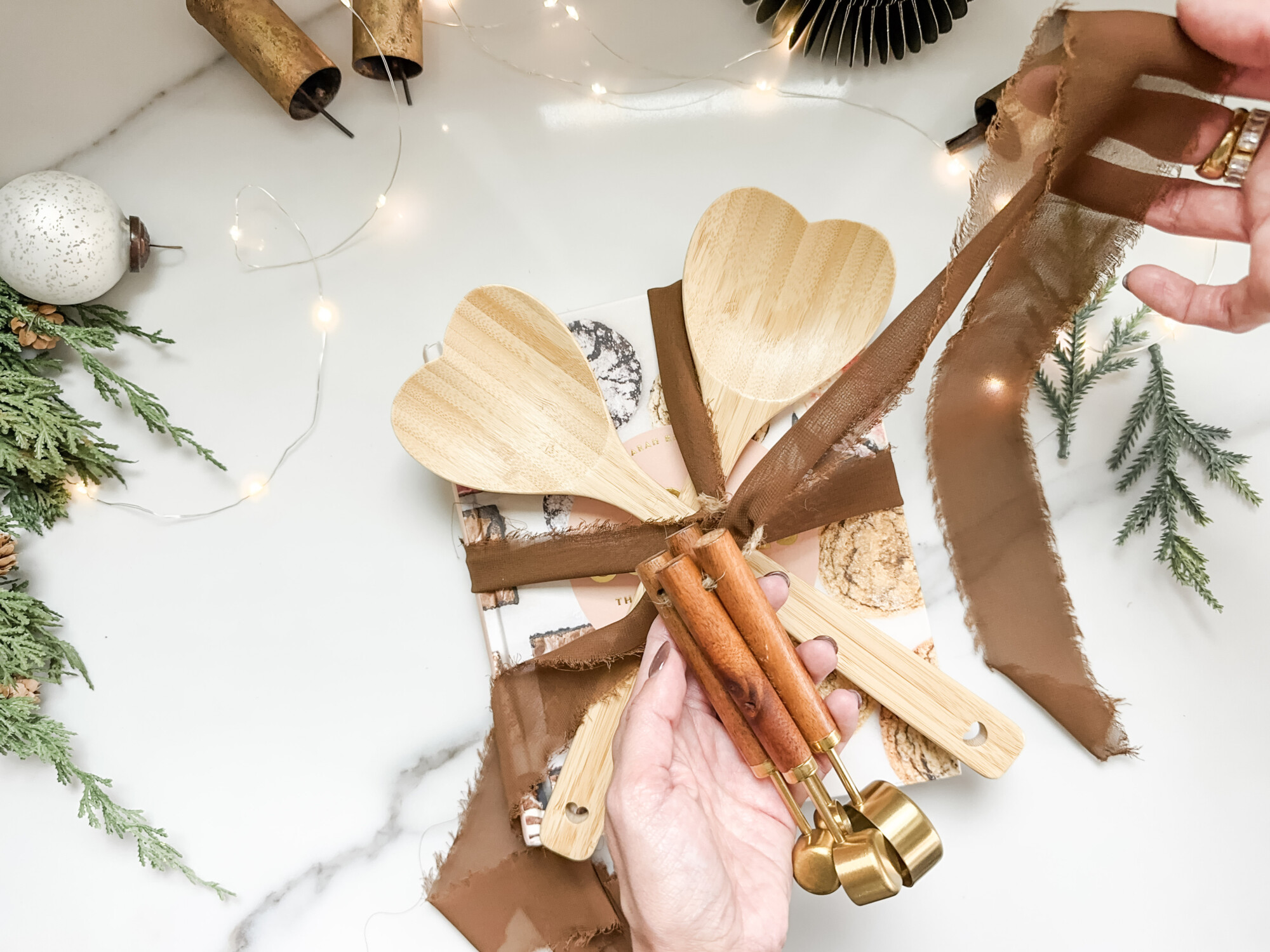 thoughtful and affordable diy host gifts under $35 | host gifts, diy gifts, gift ideas, handmade gift, gift ideas, cookie recipe, wooden spoon, tablesoon set, brass bell