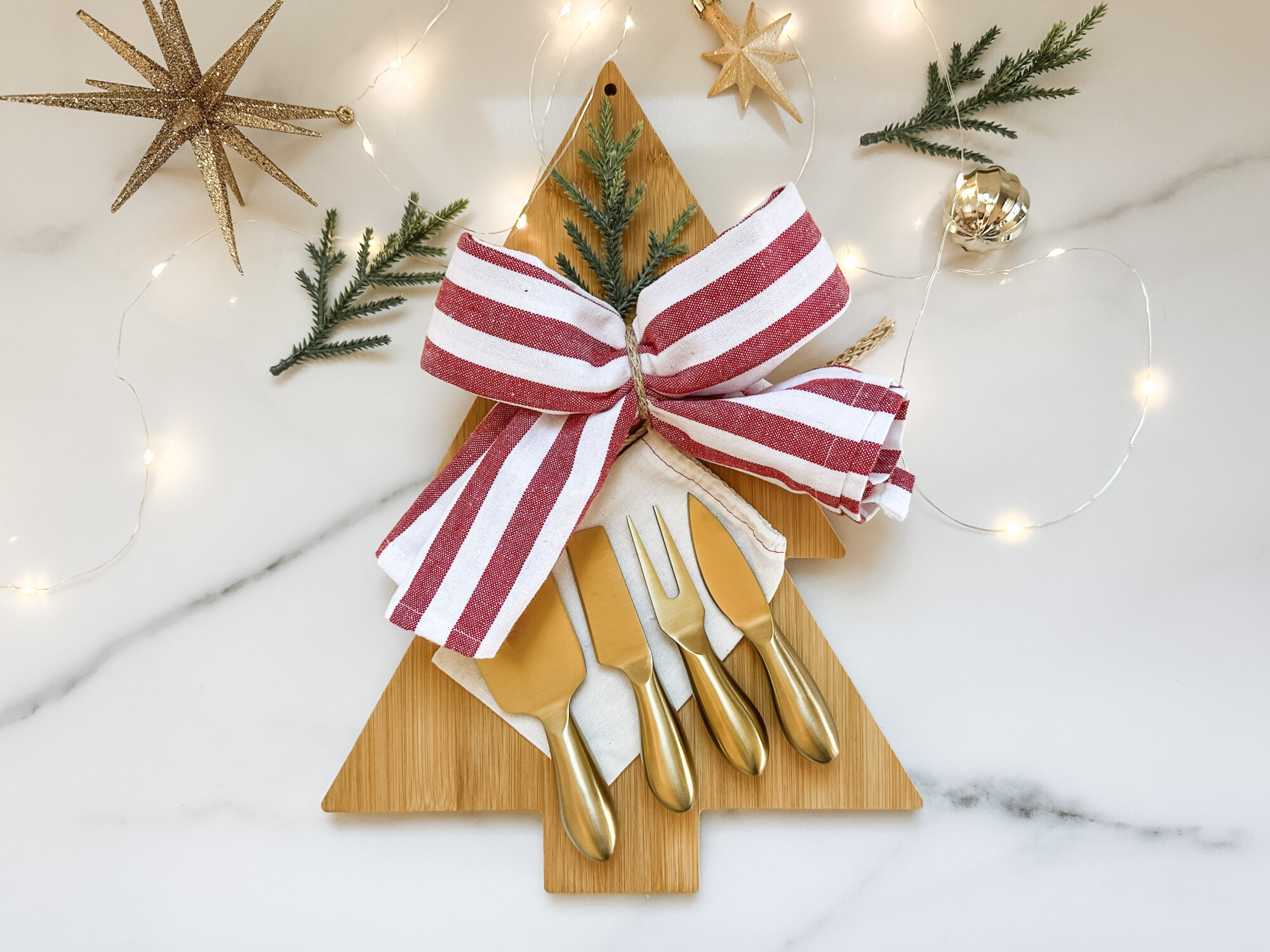 thoughtful and affordable diy host gifts under $35 | host gifts, diy gifts, gift ideas, handmade gift, gift ideas, starburst ornament, tiny ornament, brass knives, charcuterie knives, dish towel, tea towel
