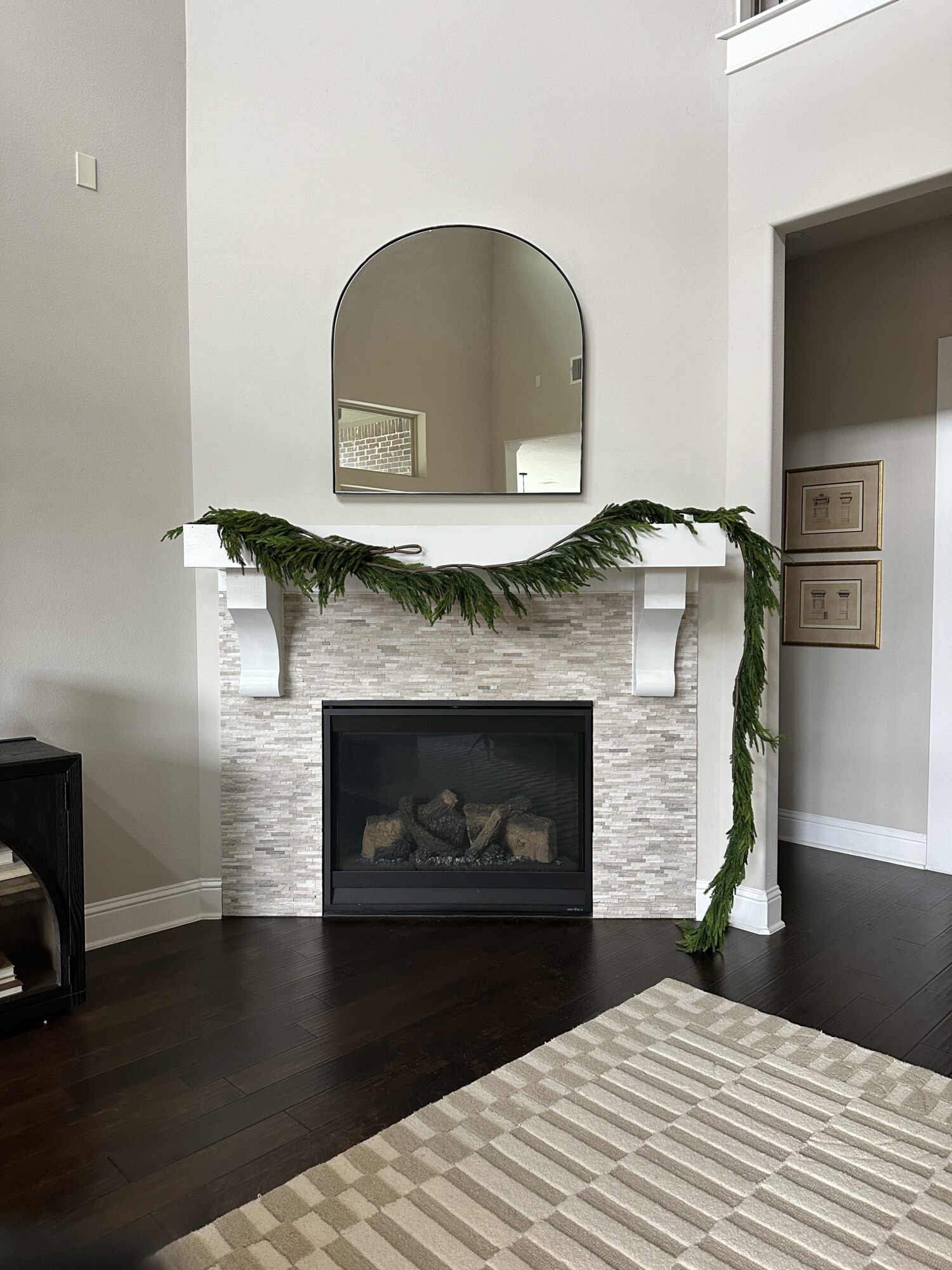 'Tis the Season to Style Your Holiday Mantel | garland, holiday, style, mantel, fireplace, mirror, living room