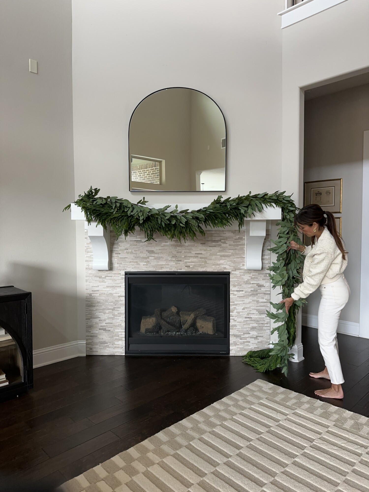 'Tis the Season to Style Your Holiday Mantel | garland, holiday, style, mantel, fireplace, mirror, living room, decor, christmas