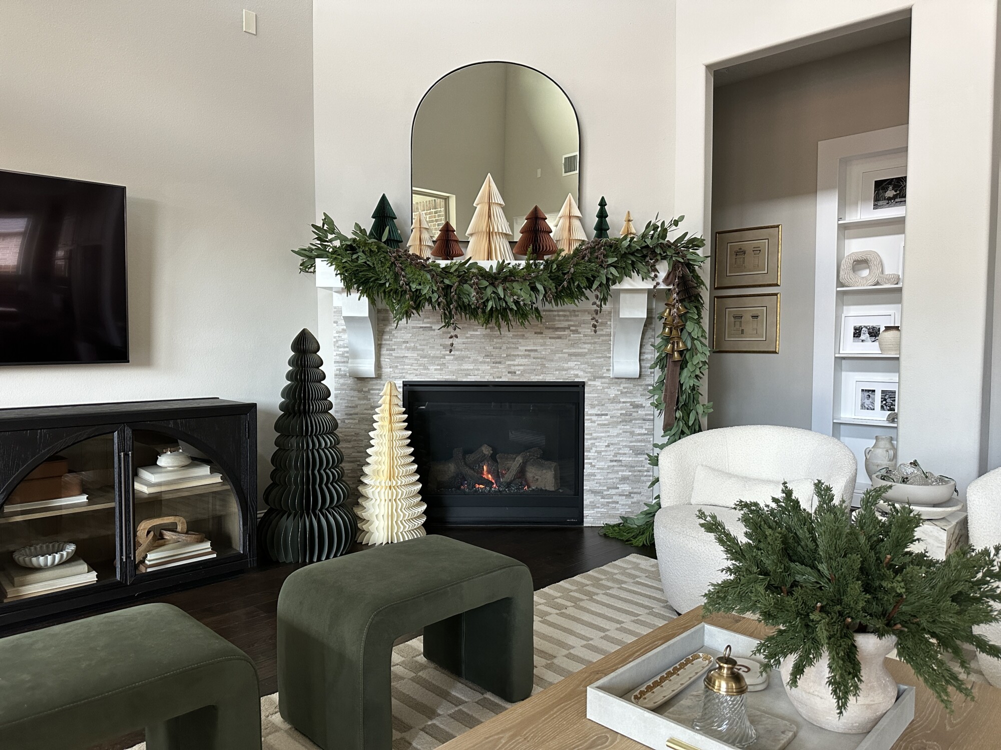 'Tis the Season to Style Your Holiday Mantel | holiday, christmas, garland, living room, decor, christmas tree, fireplace, mantel, honeycomb tree, fireplace decor, ottoman, tv stand, coffee table, fire, chair
