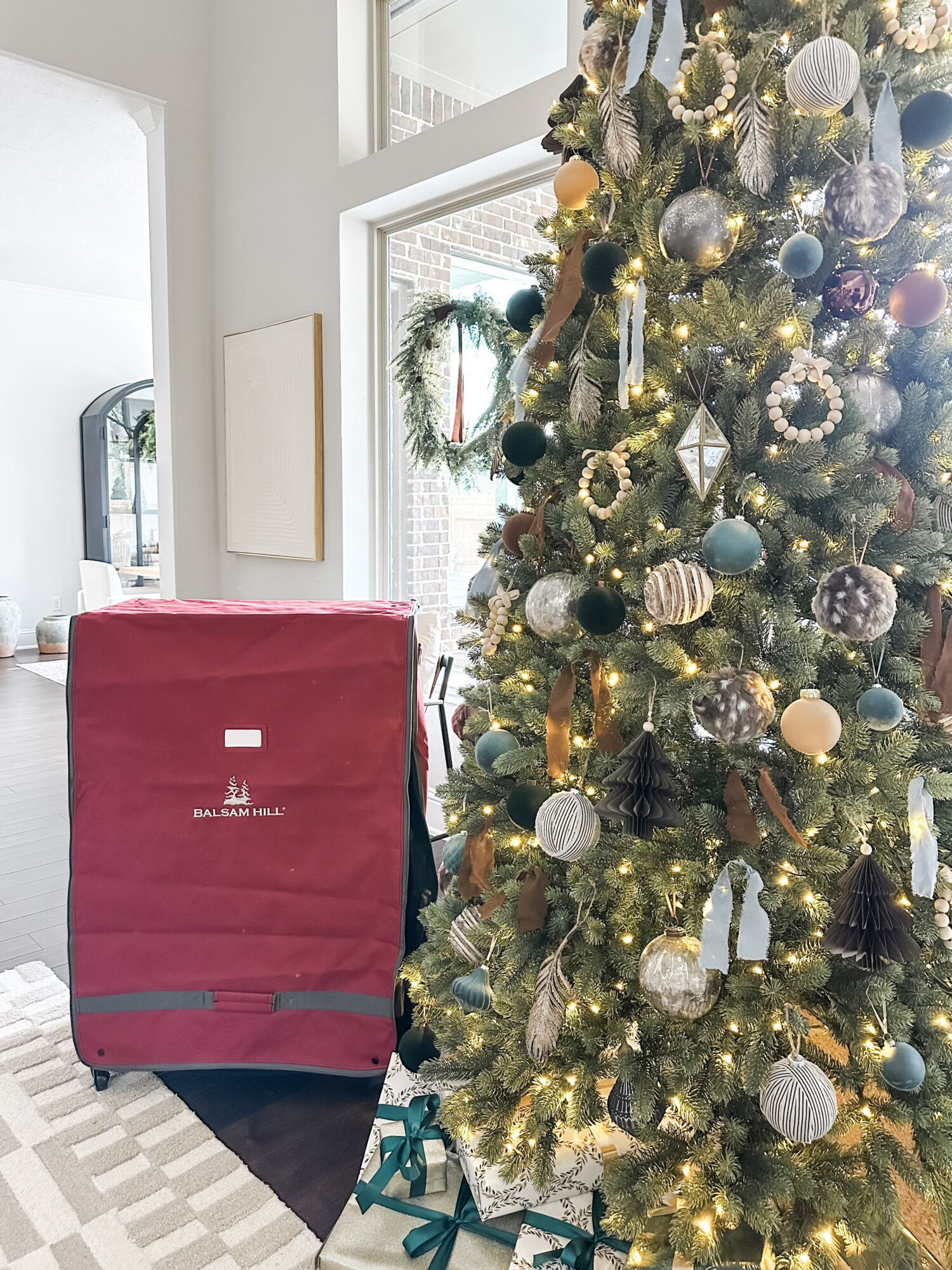 top holiday storage tips for year-round organization | holiday, christmas, storage, organization, holiday decor, rolling ornament cart, christmas tree, wreath, ornaments, ribbon bows, neutral home