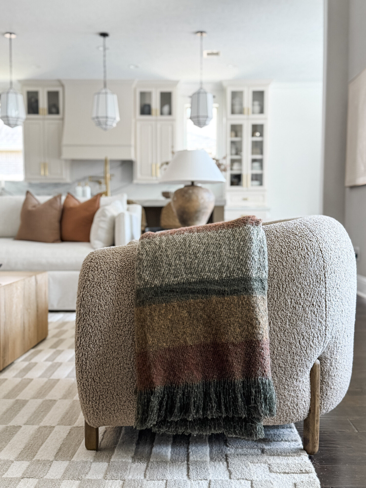 brown accent chair with throw blanke